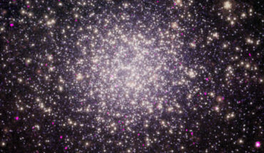 This composite image shows Omega Centauri, a globular cluster some 17,710 light-years away in the constellation of Centaurus; in the image, the Chandra data are shown along an optical view from Hubble and infrared view from Spitzer. Image credit: NASA / CXC / San Francisco State University / Cool et al. / ESA / STScI / JPL / Caltech / SAO / N. Wolk.