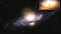 This artist impression shows ultra-fast winds blasting out from the center of galaxy Markarian 817. These winds, moving at many millions of km per hour, clear out interstellar gas from a vast region of space. Without this gas, the galaxy can’t form new stars and the black hole in the galactic center has little left to eat. The inset shows what is happening at galaxy’s heart. A supermassive black hole draws in gas from its surroundings, which forms a hot, brightly lit accretion disk (orange). The cause of the winds (white) is magnetic fields within the disk, which fling particles out in all directions at incredibly high speeds. These winds effectively block out X-rays (blue) which are sent out by the extremely hot plasma surrounding the black hole, called the corona. Zak et al. caught Markarian 817 blasting out ultra-fast winds using ESA’s X-ray telescope XMM-Newton. Lasting for around a year, the winds will have significantly affected star formation in the galaxy. The fact that the black hole at the center of the galaxy was showing rather average activity levels before producing the winds suggests that ultra-fast black hole winds are much more common than previously thought. In other words, black holes and their host galaxies strongly affect each other’s evolution. Image credit: ESA / CC BY-SA 3.0 IGO.
