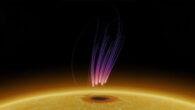 Yu et al. discovered radio bursts above a sunspot that resemble radio emissions from aurorae on Earth. The pink-purple streaks in this illustration represent the radio emissions, with higher-frequency radio signals in pink, closer to the sunspot, and lower frequencies in purple. The thin lines represent magnetic field lines above the sunspot. The sunspot is the dark region on the Sun at the bottom. Image credit: Sijie Yu, New Jersey Institute of Technology.