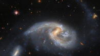 This image shows Arp 72, a galaxy pair that includes NGC 5996 (large spiral galaxy) and NGC 5994 (its smaller companion, in the lower left of the image). The color image was made from separate exposures taken in the visible and infrared regions of the spectrum with Hubble’s Advanced Camera for Surveys (ACS) and the Dark Energy Camera (DECam), which is mounted on NSF’s Víctor M. Blanco 4-m telescope at Cerro Tololo Inter-American Observatory in Chile. Four filters were used to sample various wavelengths. The color results from assigning different hues to each monochromatic image associated with an individual filter. Image credit: NASA / ESA / Hubble / L. Galbany / J. Dalcanton / Dark Energy Survey / DOE / FNAL / DECam / CTIO / NOIRLab / NSF / AURA.