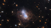 This Webb image shows I Zwicky 18, a blue compact dwarf galaxy some 59 million light-years away in the constellation of Ursa Major. A companion galaxy resides nearby to I Zwicky 18 can be seen at the bottom of the image. The companion may be interacting with the dwarf galaxy and may have triggered that galaxy’s recent star formation. Image credit: NASA / ESA / CSA / Webb / Hirschauer et al.