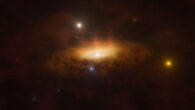 This artist’s impression shows the growing disk of material being pulled in by the black hole as it feeds on the gas available in its surroundings, making the galaxy light up. Image credit: ESO / M. Kornmesser.