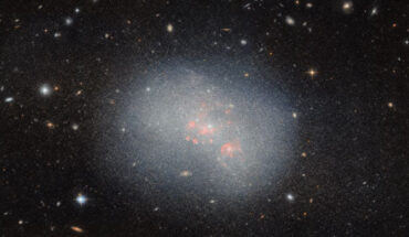 This Hubble image shows NGC 5238, a dwarf irregular galaxy located 14.5 million light-years away in the constellation Canes Venatici. The color image is made up of observations from Hubble’s Advanced Camera for Surveys (ACS) in the near-infrared and optical parts of the spectrum. Two filters were used to sample various wavelengths. The color results from assigning different hues to each monochromatic image associated with an individual filter. Image credit: NASA / ESA / Hubble / F. Annibali.