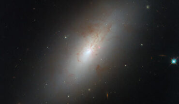 This Hubble image shows NGC 4694, a lenticular galaxy some 54 million light-years in the constellation of Virgo. The color image is made up of observations from Hubble’s Wide Field Camera 3 (WFC3) in the ultraviolet, near-infrared, and optical parts of the spectrum. It is based on data obtained through six filters. The color results from assigning different hues to each monochromatic image associated with an individual filter. Image credit: NASA / ESA / Hubble / D. Thilker.