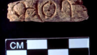 The 4,400-year-old clay object discovered at the ancient city of Umm el-Marra, Syria; the engraved symbols may be part of the earliest known alphabet. Image credit: Glenn Schwartz, Johns Hopkins University.
