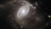 This Hubble image shows LEDA 22057, a spiral galaxy some 650 million light-years away in the constellation of Gemini. Image credit: NASA / ESA / Hubble / R.J. Foley, UC Santa Cruz.