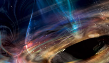 In this artist’s concept, matter is stripped from a white dwarf (sphere at lower right) orbiting within the innermost accretion disk surrounding 1ES 1927+654’s supermassive black hole. Image credit: NASA / Aurore Simonnet, Sonoma State University.