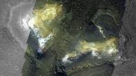 Two Martian mounds, rising hundreds of meters above the surrounding lowlands, display bright regions rich in clay minerals. Image credit: ESA / TGO / CaSSIS / NASA / JPL / MSSS / Murray Lab.