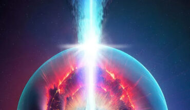 A high-energy photonic jet (white and blue) blasts through a collapsar with a black hole at its center; the red space around the jet represents the cocoon where free neutrons may be captured causing the r-process, the nucleosynthesis that results in the formation of heavy elements. Image credit: Los Alamos National Laboratory.