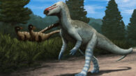 Life restoration of Obelignathus septimanicus in the Late Cretaceous environment recorded in the ‘Grès à Reptiles’ Formation, with a pair of dromaeosaurid dinosaurs in the background. Image credit: Edyta Felcyn-Kowalska.