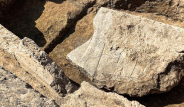 A fragment of the 2,600-year-old stone relief from the archaeological site of Nineveh. Image credit: Aaron Schmitt.