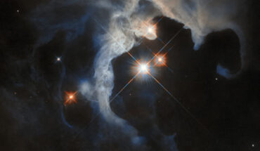 This Hubble image shows GN 04.32.8, a reflection nebula some 480 light-years away in the constellation of Taurus. The color composite was assembled from images taken in visible and near-infrared light. It is based on data obtained through two filters. The color results from assigning different hues to each monochromatic image associated with an individual filter. Image credit: NASA / ESA / Hubble / G. Duchêne.
