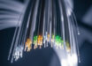 Petrovich et al. report a microstructured optical waveguide with unprecedented transmission bandwidth and attenuation. Image credit: Gemini AI.