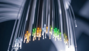 Petrovich et al. report a microstructured optical waveguide with unprecedented transmission bandwidth and attenuation. Image credit: Gemini AI.