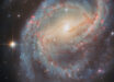 This Hubble image shows NGC 6951, a barred spiral galaxy some 70 million light-years away in the constellation of Cepheus. The color image was made from separate exposures taken in the visible and near-infrared regions of the spectrum with Hubble’s Advanced Camera for Surveys (ACS). Two filters were used to sample various wavelengths. The color results from assigning different hues to each monochromatic image associated with an individual filter. Image credit: NASA / ESA / Hubble / L.C. Ho / G. Brammer / A. Filippenko / C. Kilpatrick.