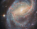 This Hubble image shows NGC 6951, a barred spiral galaxy some 70 million light-years away in the constellation of Cepheus. The color image was made from separate exposures taken in the visible and near-infrared regions of the spectrum with Hubble’s Advanced Camera for Surveys (ACS). Two filters were used to sample various wavelengths. The color results from assigning different hues to each monochromatic image associated with an individual filter. Image credit: NASA / ESA / Hubble / L.C. Ho / G. Brammer / A. Filippenko / C. Kilpatrick.