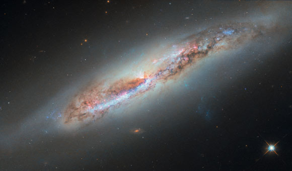 This Hubble image shows NGC 4388, a spiral galaxy some 59 million light-years in the constellation of Virgo. Image credit: NASA / ESA / Hubble / S. Veilleux / J. Wang / J. Greene.