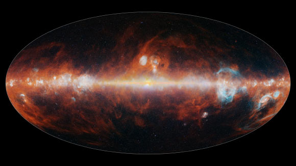 This infrared image from SPHEREx features a selection of colors emitted primarily by stars (blue, green, and white), hot hydrogen gas (blue), and cosmic dust (red). Image credit: NASA / JPL-Caltech.