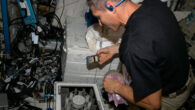 NASA astronaut Michael Scott Hopkins performs a microgravity experiment on the International Space Station. Image credit: NASA.