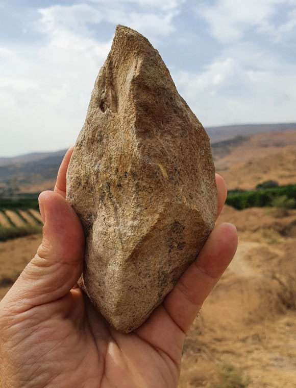 A bifacial stone tool from the site of Ubeidiya in Israel. Image credit: Omry Barzilai.