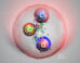 An artist’s impression of the doubly charmed baryon Ξcc⁺, which contains two charm quarks and one down quark. Image credit: CERN.
