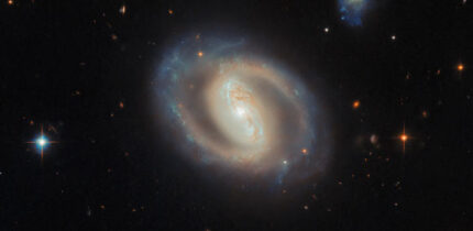 This Hubble image shows IC 486, a barred spiral galaxy some 380 million light-years away in the constellation of Gemini. Image credit: NASA / ESA / Hubble / M.J. Koss / A.J. Barth.