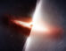 Radio signal from the quasar TXS 2005+403 travels roughly 10 billion light-years to reach Earth, traversing the Cygnus region, one of the most turbulent and scattering environments in the Milky Way Galaxy. On the left, this artist’s conception shows the quasar as it truly appears, with a bright accretion disk and jets blasting into the Galaxy like a beacon through the darkness. On the right, we see how turbulent gas distorts scientists’ view of the quasar in much the same way heat haze from a fire warps our view of the objects behind it. Image credit: Melissa Weiss / CfA.