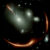 This Webb image shows the highly distorted red galaxy MRG-M0138 seen through a foreground cluster of galaxies (white sources). Image credit: NASA / ESA / CSA / Webb.