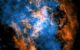 This image shows the evidence for the wind blowing away from Sagittarius A*: the white dot in the center of the image shows the supermassive black hole; in orange is data from ALMA, mapping the location of cold gas composed of carbon monoxide in the image; in blue is X-ray data from Chandra; a large cone-shaped cavity, visible as an absence of cold gas in the ALMA data, is filled by hot X-ray-emitting gas in the Chandra data. Image credit: NASA / CXC / UMass / Wang et al. / ALMA / ESO / NAOJ / NRAO / Longmore et al. / Minniti et al.