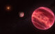 This illustration shows the stellar system CD-35 2722, with the newly found exomoon at the center; the star has about half the mass of our Sun, and it is orbited by a brown dwarf, the reddish-brown object seen here in the foreground (right). Image credit: ESO / M. Kornmesser.