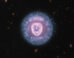 This Webb/NIRCam/MIRI image shows the Eskimo Nebula, a bipolar planetary nebula some 4,200 light-years away in the constellation of Gemini. Image credit: NASA / ESA / CSA / Webb / STScI / Alyssa Pagan, STScI.