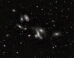 This image shows the Copeland Septet, a group of galaxies located in the constellation of Leo. Image credit: DESI Legacy Imaging Surveys / LBNL / DOE / KPNO / CTIO / NOIRLab / NSF / AURA.