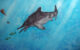 An artistic reconstruction of Jabalisaurus tethyensis, depicted in the water column close to the surface while pursuing halecomorph fishes. Image credit: Giovanni Serafini.