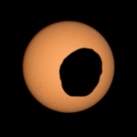 This image of Phobos in front of the Sun was captured by Perseverance’s Mastcam-Z camera on August 12, 2026. Image credit: NASA / JPL-Caltech / ASU / MSSS / SSI.
