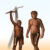 A depiction of an early Homo (right) characterized by relatively greater bone strength of the femur in the thigh compared to the humerus in the arm, and a depiction of an older human ancestor, Australopithecus (left), characterized by more equivalent strength in the bones of the arm and thigh. Image credit: Cullen Townsend.
