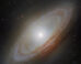 This Hubble image shows NGC 4698, a barred spiral galaxy some 55 million light-years away in the constellation of Virgo. Image credit: NASA / ESA / Hubble / D. Thilker, MAUVE-HST Team.