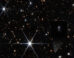 This Webb image shows the host galaxy of FRB 20240304B (shown by the white cross). Image credit: NASA / ESA / CSA / STScI / Themiya Nanayakkara, USYD / Joseph DePasquale, STScI.