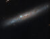 This Hubble image shows the edge-on, intermediate spiral galaxy NGC 1827. Image credit: NASA / ESA / Michael Jones, California Institute of Technology / Gladys Kober, NASA / Catholic University of America.