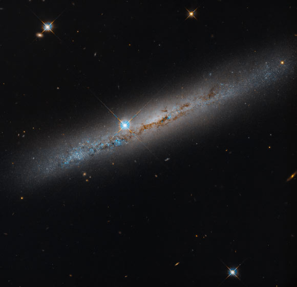 Hubble Space Telescope Spots Dusty Spiral Galaxy: NGC 1827